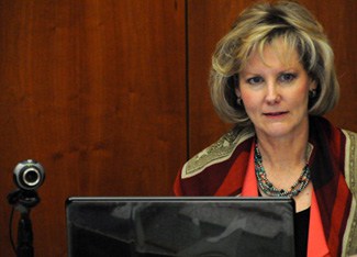 State Rep. Janice Arnold-Jones webcasting a committee meeting earlier this year. (Photo by Heath Haussamen)