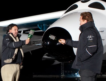 Govs. Bill Richardson and Arnold Schwarzenegger name SpaceShipTwo as the VSS Enterprise. (Photo by Mark Greenberg/Virgin Galactic)
