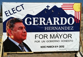Gerardo Hernandez, shown here in a campaign sign, is the alleged victim of the extortion plot. (Photo by Heath Haussamen)