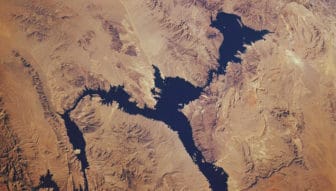 Lake Mead, formed by the Hoover Dam on the Colorado River, is the largest reservoir in the United States. It’s seen here from space in 1985.