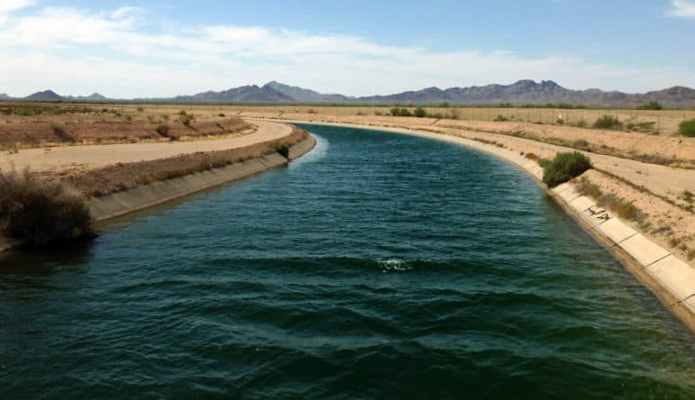 Engineers have turned the Colorado River into one of the world’s largest plumbing systems, which included building the Central Arizona Project canal, shown here. A vestige of 139-year-old water law pushes ranchers to use as much water as they possibly can, even during a drought. 