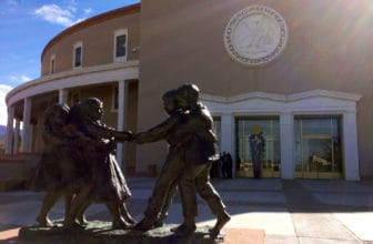 A statue of children outside the Roundhouse in Santa Fe.