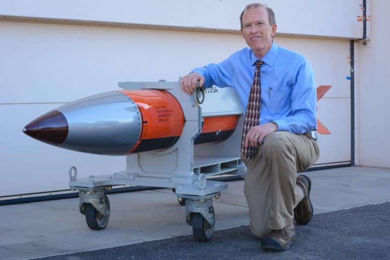 Phil Hoover, an engineer at Sandia National Laboratories, shows off a flight test body for a B61-12 nuclear weapon. Sandia engineers have spent the past few years designing, building and testing the top-secret electronic and mechanical innards of the bomb.
